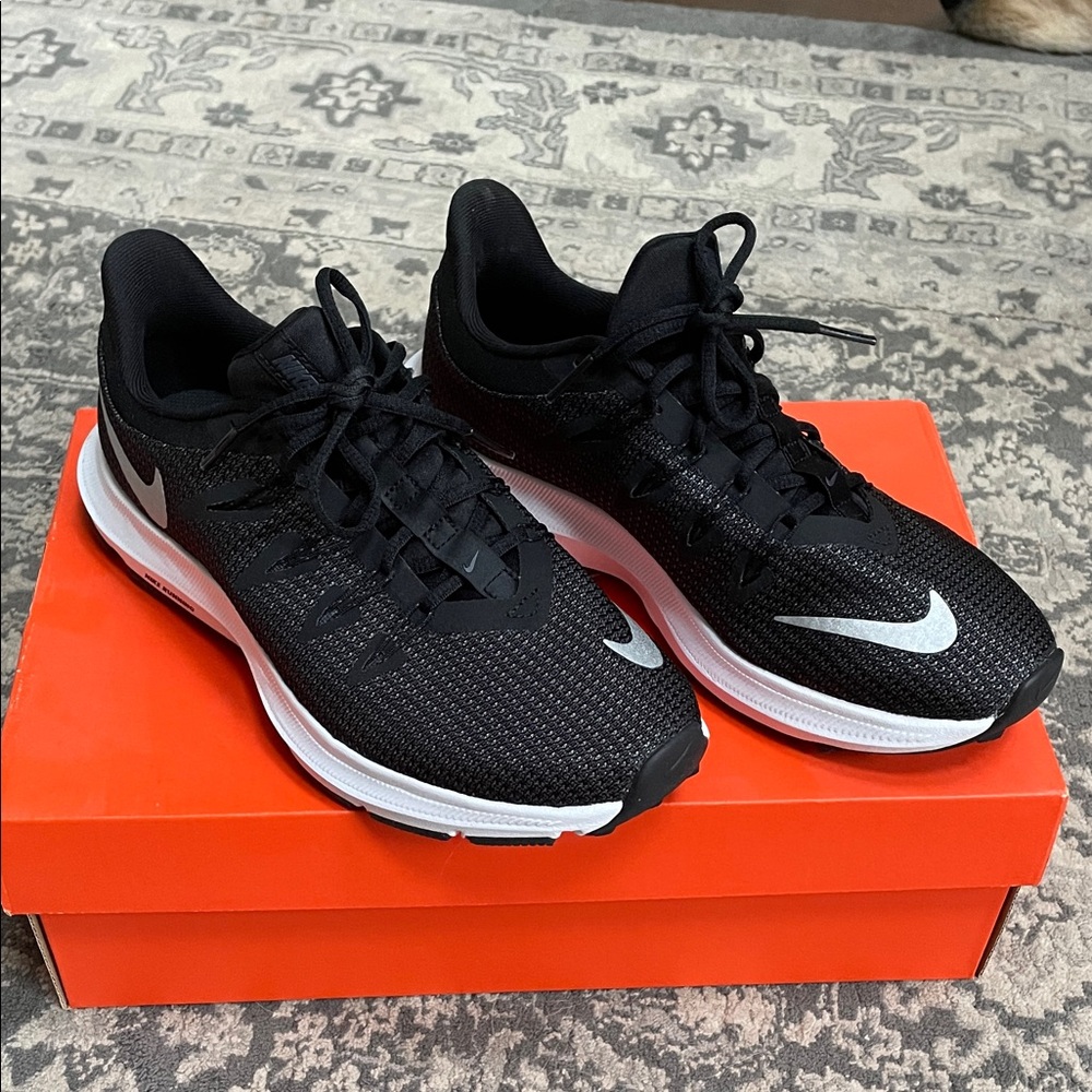 Nike women’s quest running shoes. Size 6.5. Worn once. Excellent condition.